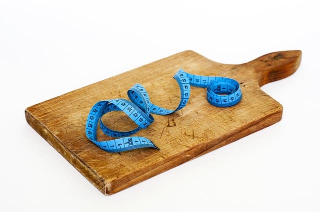 Hoe werkt afvallen met calorieen? Alles wat jij moet weten! 2 Plan met meetlint